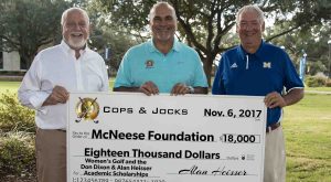 Richard Reid and Coach Mike Fluty of McNeese receives check from Alan Heisser of Cops and Jocks