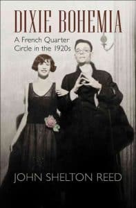 A full body shot of a man and woman in 1920's dress under the title Dixie Bohemia.