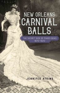 Full cover photo of Jen's book. A woman stands posing in a ball gown with a crown and scepter