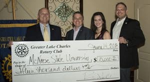 Dr. Daryl Burckel and Jennifer Leger of McNeese accept a $5,000 check from Ryan Abell and Vic Wukovits of the Greater Lake Charles Rotary Club