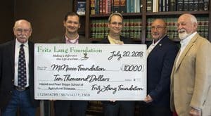 Dwight Bertrand, Dr. Chip LeMieux, Dr. Mitchell Adrian and Richard Reid of McNeese accept a check from Edwin Ford Hunter of Fritz Lang Foundation.