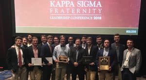 Members of the Theta Rho Kappa Sigma chapter stand with all of their awards.