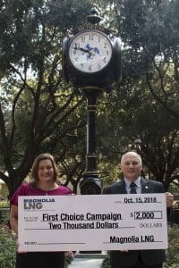 Tammy Truax of Magnolia LNG presents a check to McNeese President Dr. Daryl V. Burckel