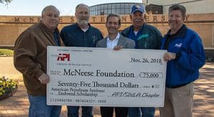 Butch Ferdinandsen, center, president-elect for the McNeese Foundation Board of Directors, accepts the donation from SWLA Chapter of API board members, from left, A.J. Vincent, James Nugent, Pat Hay and Todd Hine.