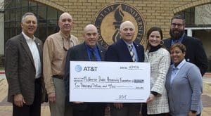 from left, state Rep. Mark Abraham (R-District 36), Sen. Dan W. "Blade" Morrish (R-District 25), Blaine E. Kelly, strategic account lead, government and education solutions, AT&T Services,  McNeese President Dr. Daryl Burckel, Sarah Allen, regional director, external and legislative affairs, AT&T Services, Chance Henry, AT&T retail store manager for Sulphur, and Meghan Perrodin, AT&T assistant store manager in Lake Charles.