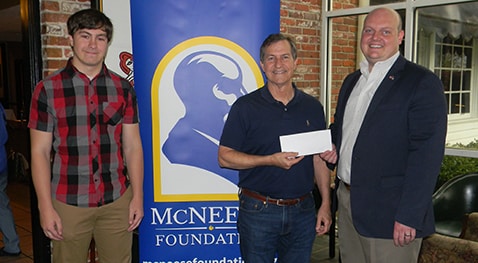 Nathaniel "Nate" Willett, a Vinton history major and current recipient of the Dr. Robert Forrest History Scholarship, David Stine, McNeese Foundation Board of Directors member, and Mayor Nic Hunter.  