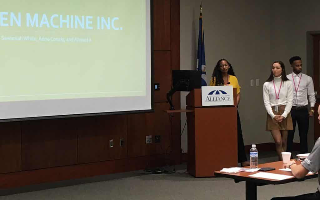 Hult Prize team members Adria Conley, Savannah White and Ahmad Alnakhy present their business idea.