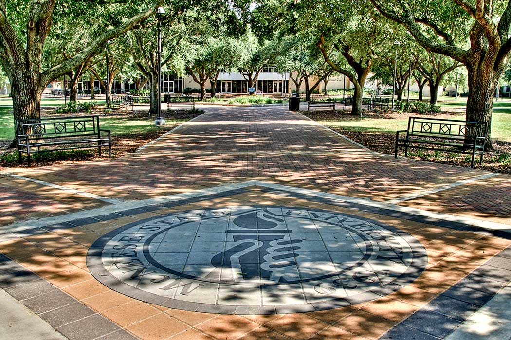 McNeese Seal under oak trees