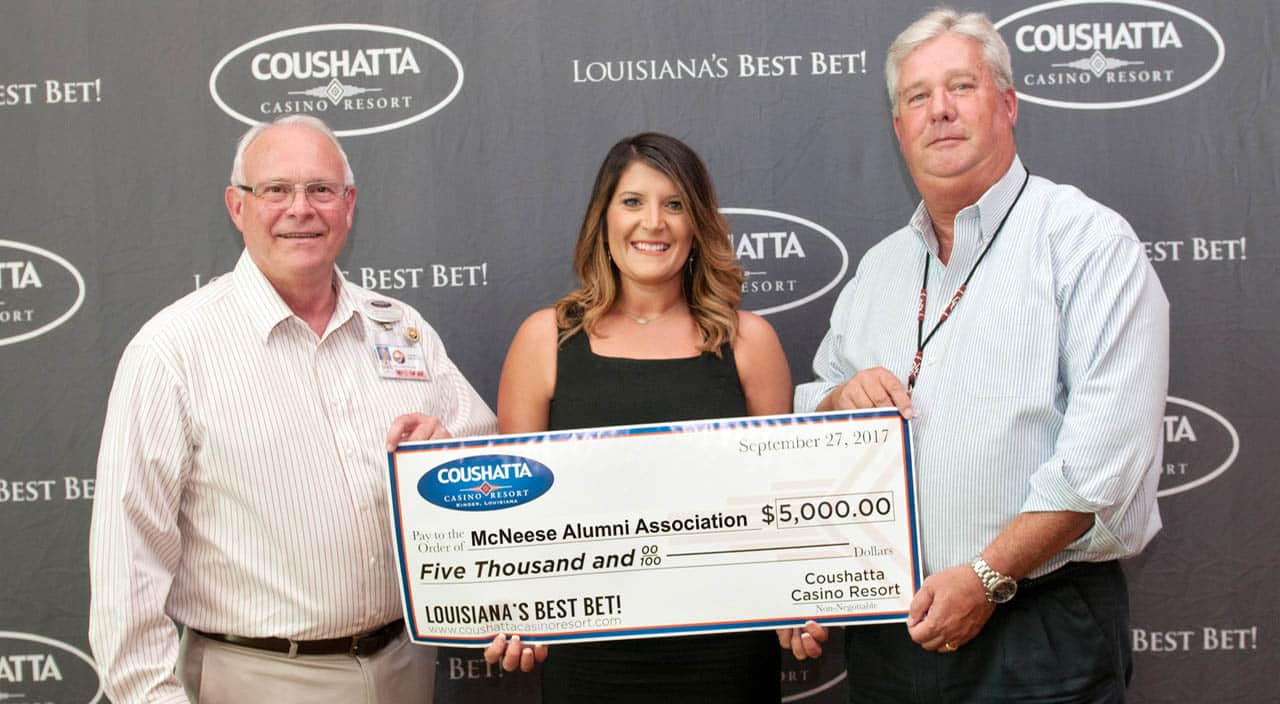 Bill Gadberry and Greg Raymor of Coushatta present a check to Stephanie Clark of McNeese Alumni.