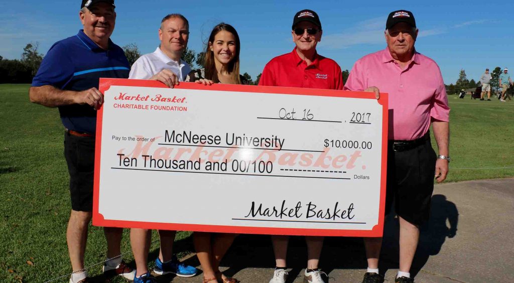 Steve Cormier, Russell Saleme, Skylar Thompson, and Keith Dauterive of Market Basket present a check to Kassidy Conrad the McNeese scholarship recipient.