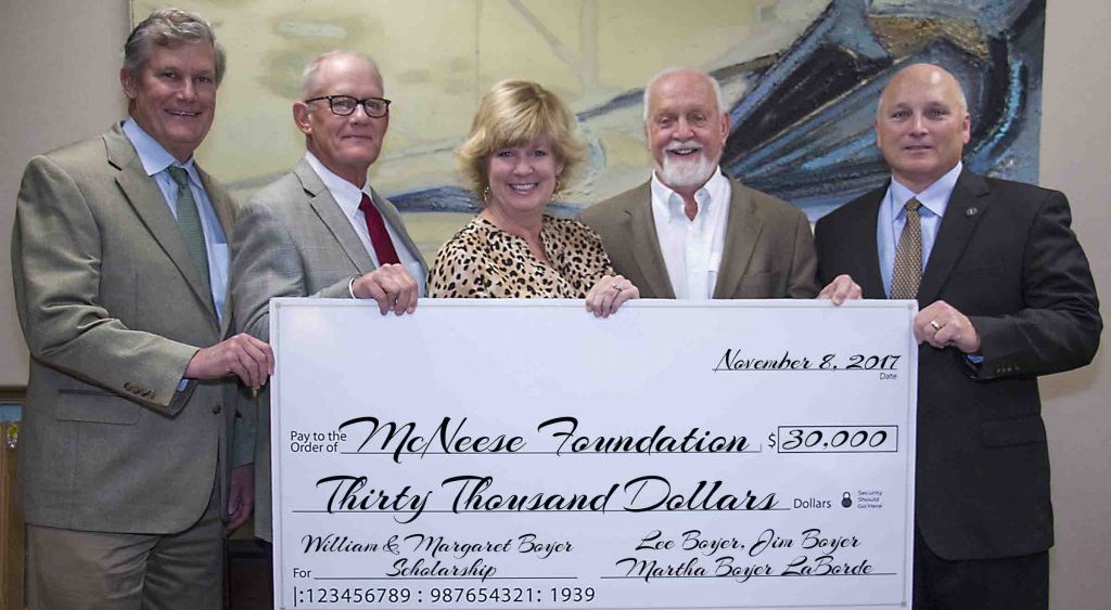 Lee and Jim Boyer with Martha Boyer LaBorde present a check to Richard Reid and Dr. Daryl Burckel of McNeese.