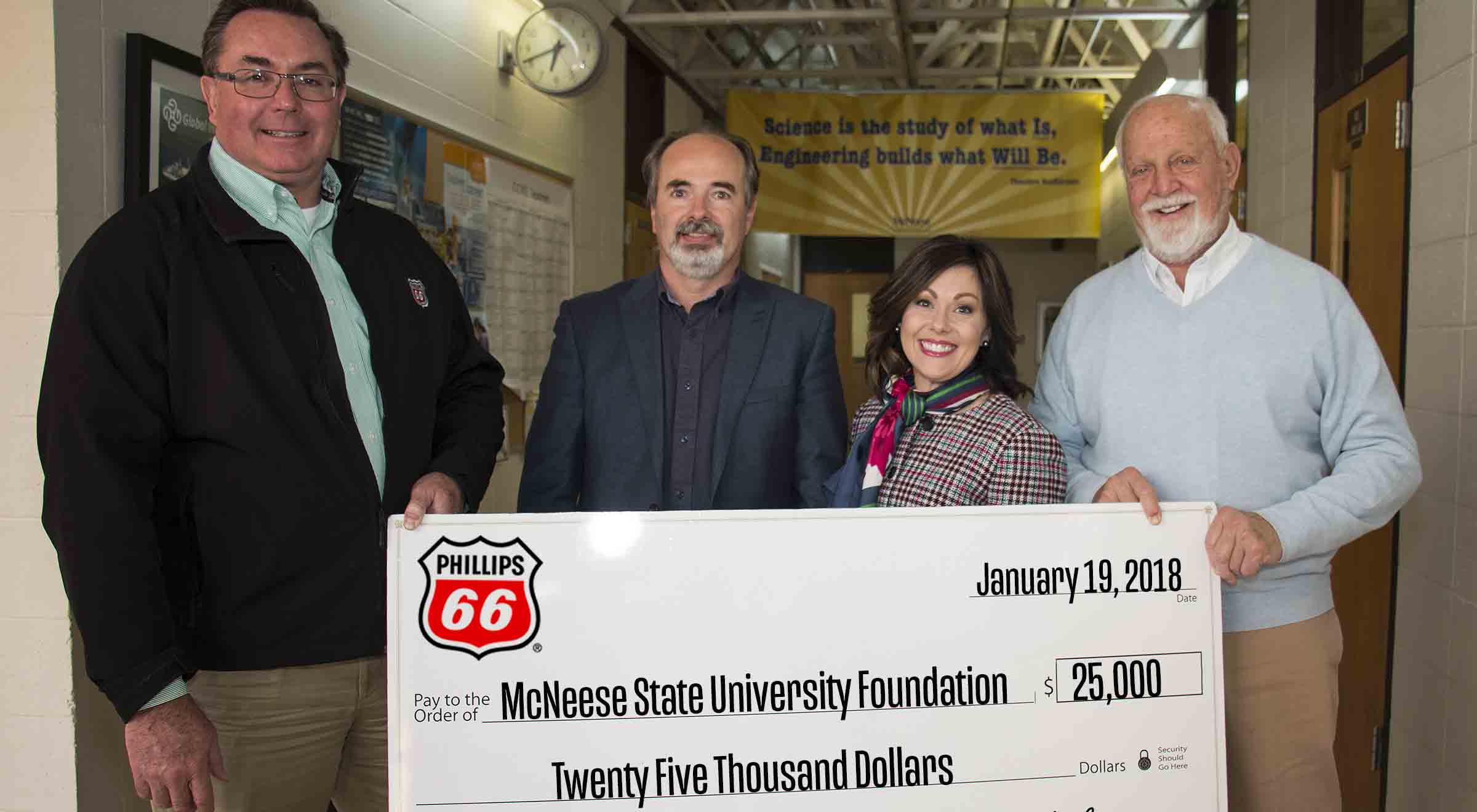 Foundation.Phillips66 donation.crop Dr. Nikos Kiritsis and Richard H. Reid of McNeese stand with Richard G Harbison and Megan Hartman of Phillips 66 for the check presentation.
