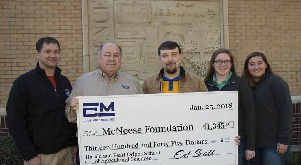 Dr. Chip LeMieux, Kealy Stelly and Shae Doucet of McNeese stand with Ed Scott of Cal-Maine Foods