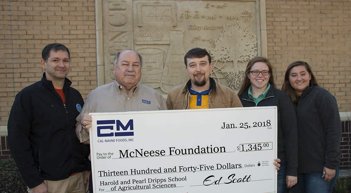 Foundation.US Poultry donation.crop Dr. Chip LeMieux, Kealy Stelly and Shae Doucet of McNeese stand with Ed Scott of Cal-Maine Foods