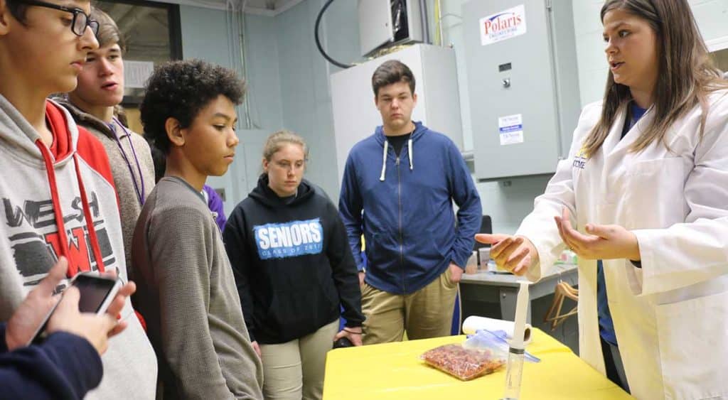 Visitors watch a demonstration by a McNeese student.