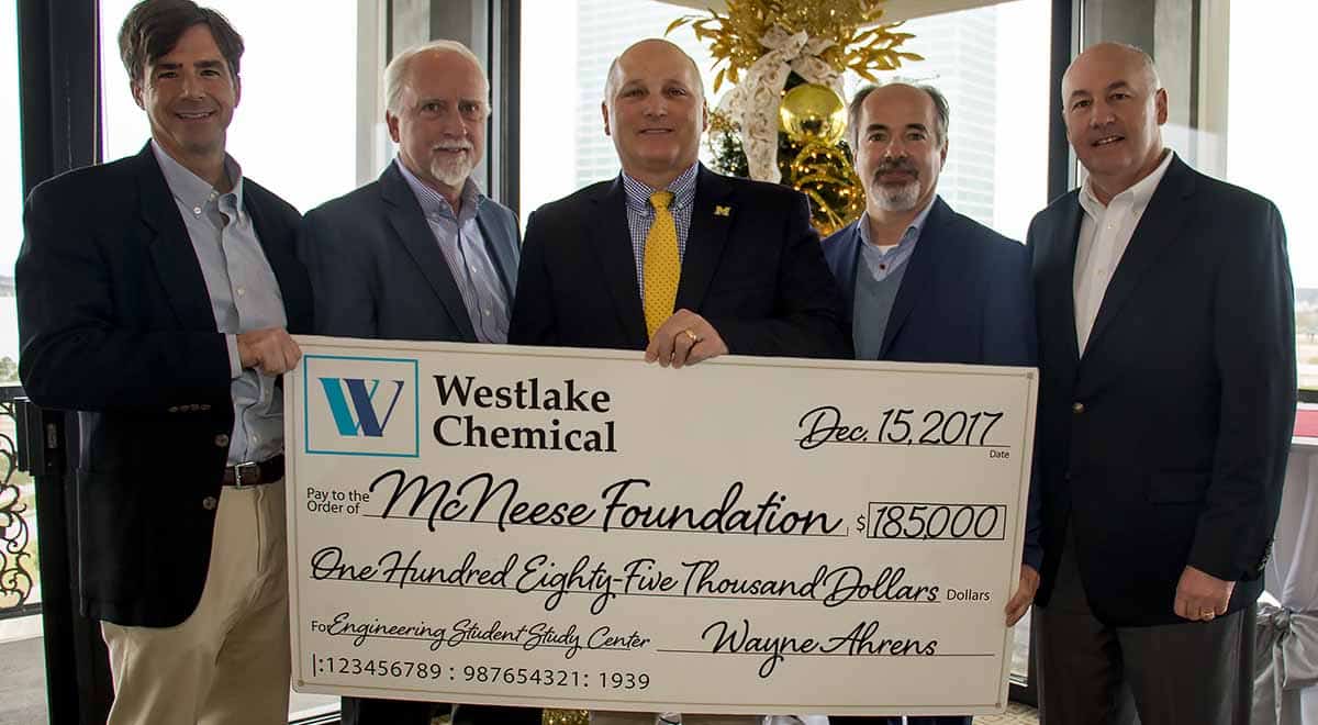 Westlake Chemical. donation.12.15.17crop Curtis Breshcer, Wayne Ahrens, and Joe Andrepont of Westlake Chemical stand with Dr. Daryl Burckel and Dr. Nikos Kiritsis of McNeese for the check presentation.