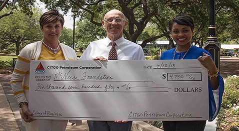 3crop.Foundation.Citgo.CoB donation.4.18.18 Mickey Mancuso and Petula Glaspie of Citgo present a check to Dr. Lonnie Phelps of McNeese