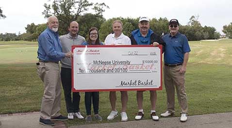 MarketBasket.Foundation.crop Richard H. Reid, vice president for university advancement and executive vice president for the foundation; David Thompson, Market Basket director of merchandising; scholarship recipient Gabrielle Ashford, Lake Charles education major; Russell Saleme, Market Basket vice president of sales and marketing; Steve Cormier, Market Basket vice president of retail operations; and Skylar Thompson, Market Basket president.