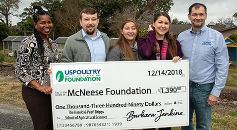 Foundation.US Poultry.crop Barbara Jenkins, executive director of the USPOULTRY Foundation, agricultural sciences instructor Devin Gandy, Shae Doucet, animal science/pre-veterinary medicine senior from Beaumont, Texas, Emerald Fletcher, a natural resource conservation management senior from Lake Charles, and Dr. Chip LeMieux, director of the school and interim dean of the College of Science and Agriculture.