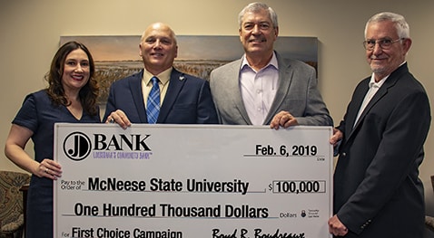 First Choice.JD.Bank donation.crop Ann Barilleaux, JD Bank vice president marketing director, McNeese President Dr. Daryl V. Burckel, Boyd R. Boudreaux, JD Bank president and CEO, and Dan L. Donald Jr., JD Bank chairman of the board