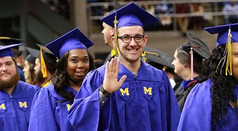 F18 Graduation Graduates smile for the camera