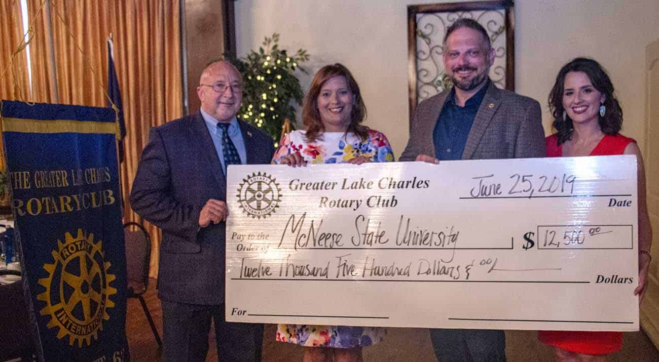 On hand for the presentation are, from the left, Dr. Mitchell Adrian, McNeese provost and vice president for academic affairs and enrollment management; Tammy Truax, Greater Lake Charles Rotary Club incoming president; Vic Wukovits, Greater Lake Charles Rotary Club current president; and Jennifer Leger, planned giving and donor research specialist with the McNeese Foundation.