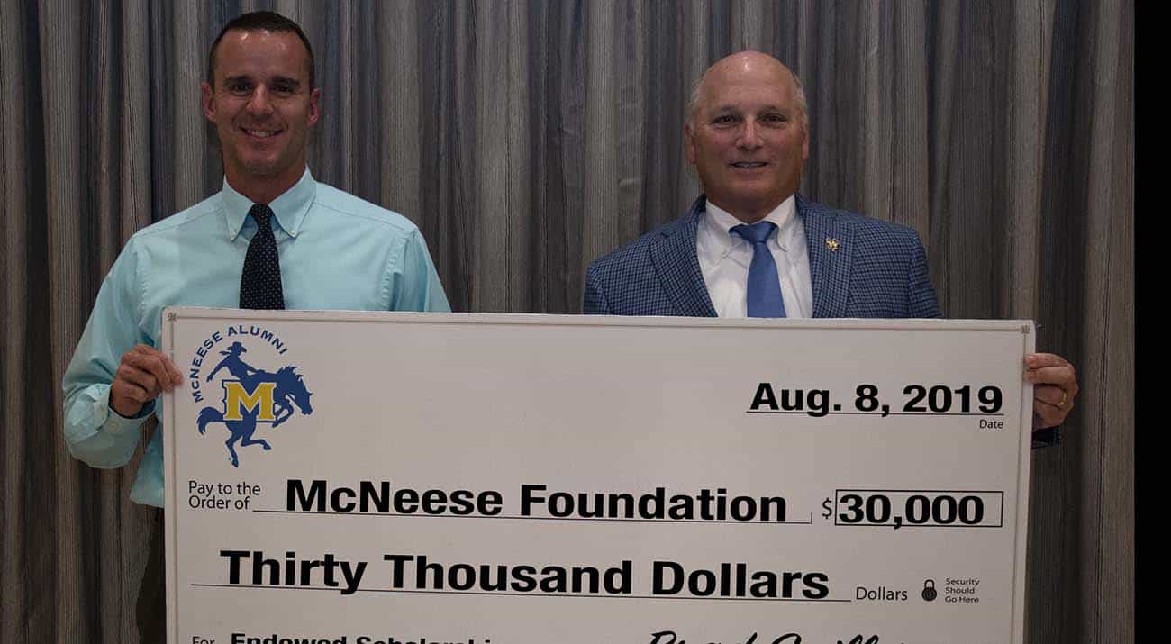 On hand for the donation are from left: Brad Guillory, president of the McNeese Alumni Association board of directors, and Dr. Daryl Burckel, McNeese president. McNeese Photo