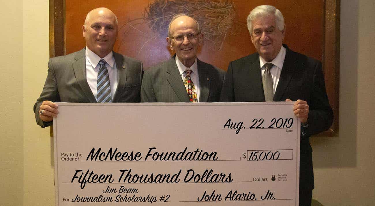 Dr. Daryl Burckel, McNeese president, Jim Beam, and John Alario Jr., Louisiana Senate president. McNeese Photo