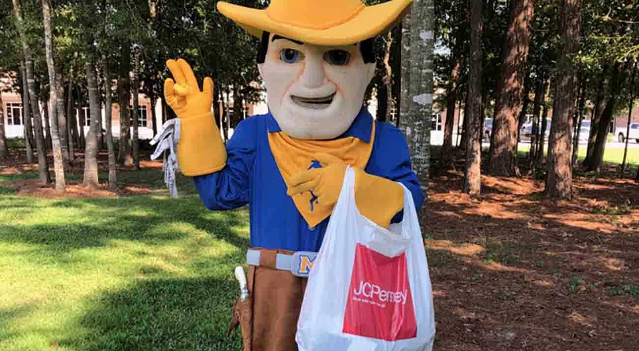 McNeese mascot Rowdy the Cowboy holds a JCPenny bag.