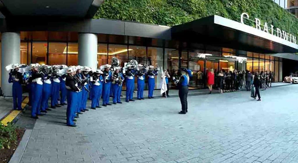 The Pride of McNeese play outside the C Baldwin Hotel