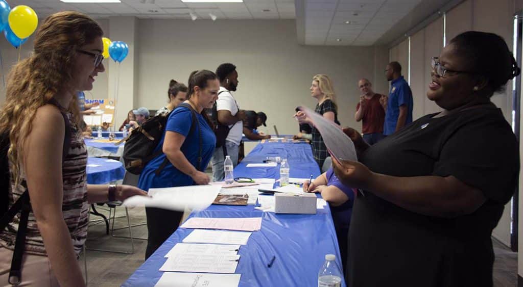 Students talk with advisors as they prepare for next semester.