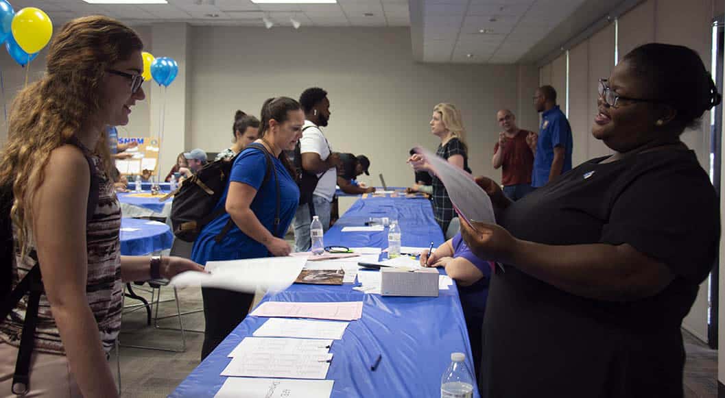 COB open house Students talk with advisors as they prepare for next semester.
