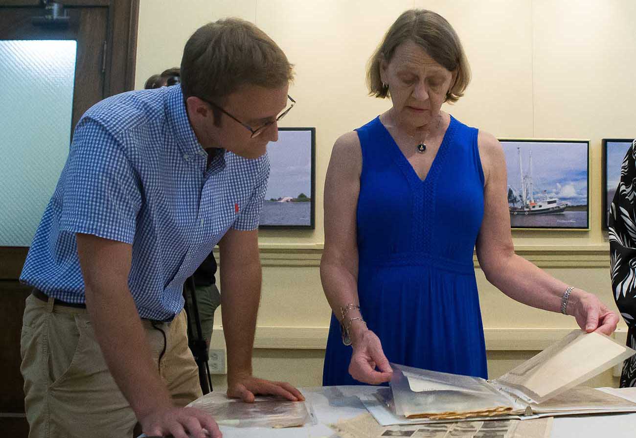 McNeese history junior Grant Leonards reviews artifacts brought in by members of the Lake Charles community for inclusion in the 1911 Historic City Hall Arts & Cultural Center’s special exhibit, “The Pelican State Goes to War: Louisiana in World War II.”