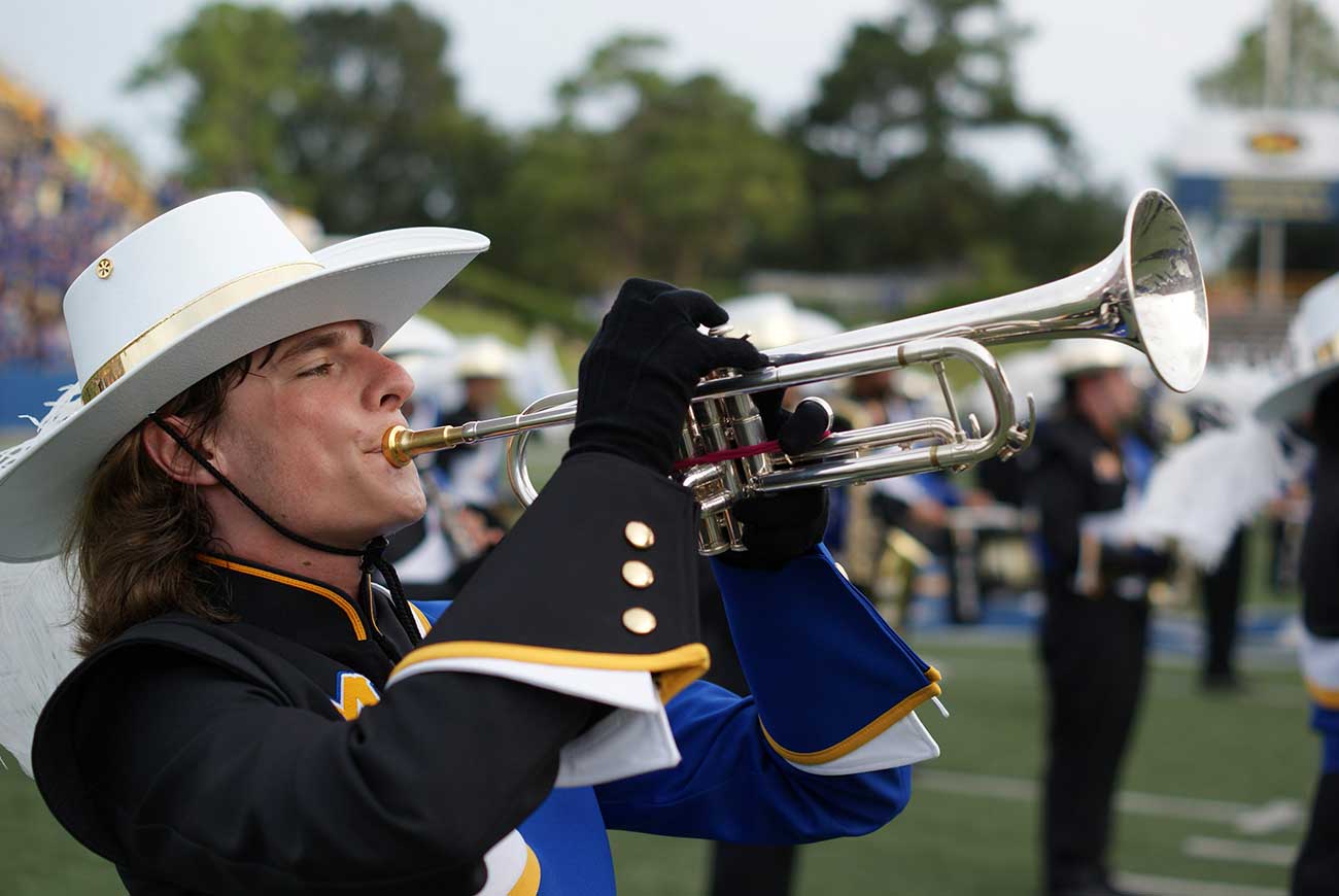 McNeese trumpter playing in the Pride of McNeese Marching Band