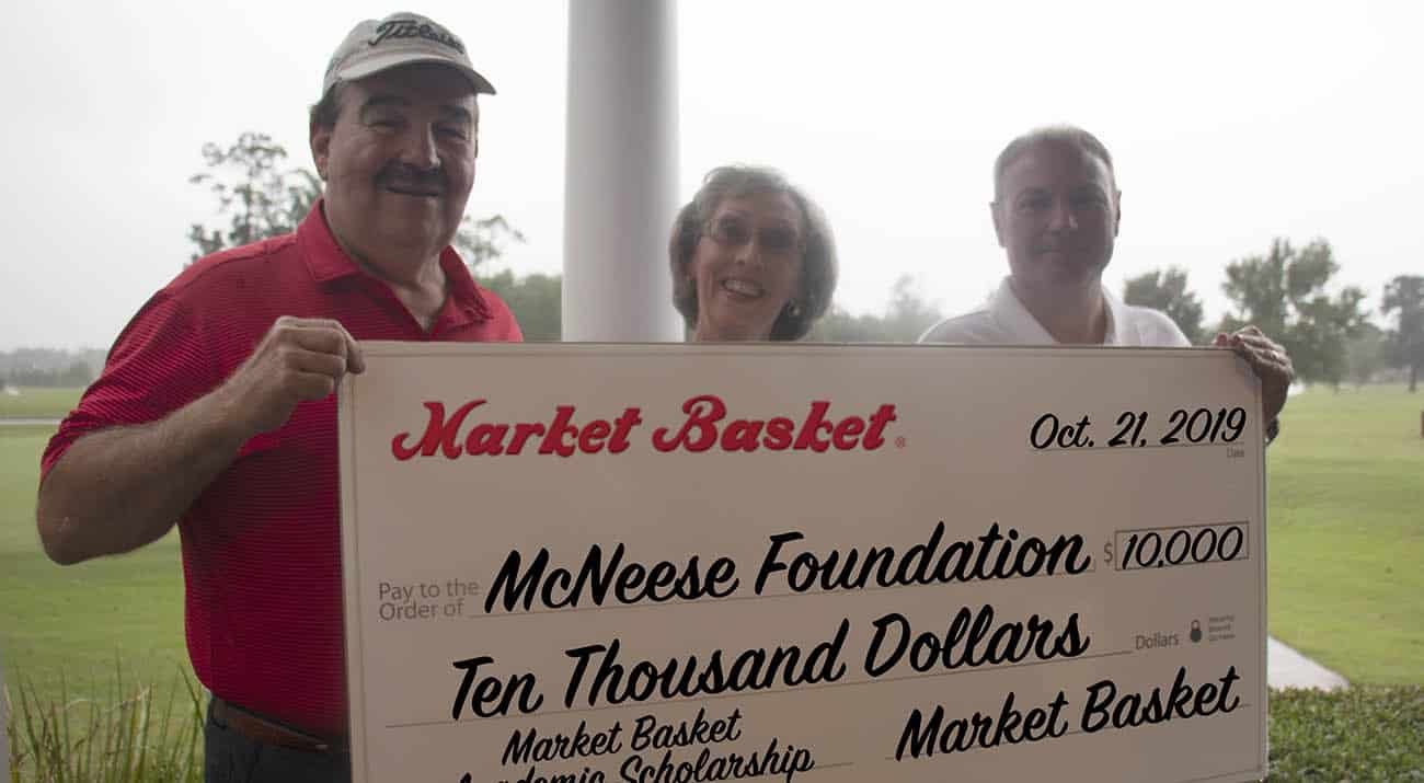 On hand for the presentation are, from left, Steve Cormier, Market Basket vice president of retail operations, Ralynn Castete, McNeese director of scholarships, and Russell Saleme, Market Basket vice president of sales and marketing.