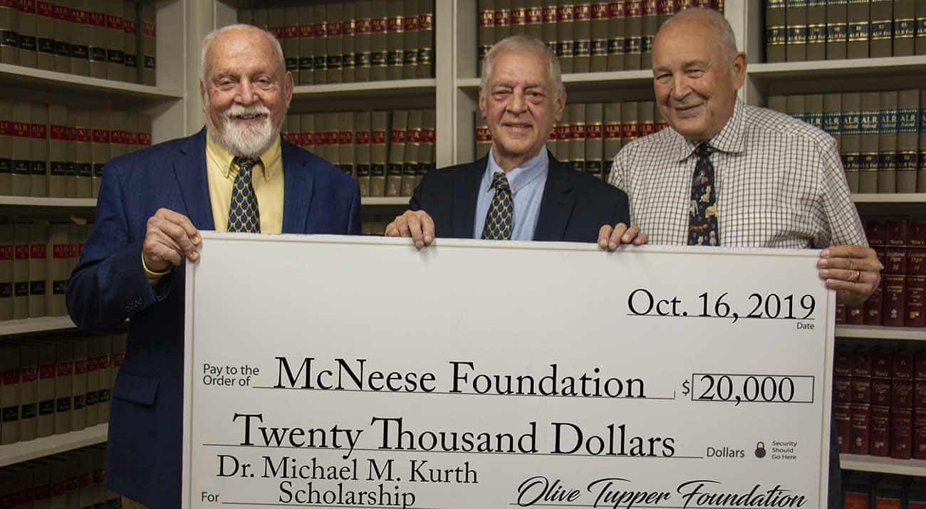 On hand for the presentation are, from left, Richard H. Reid, vice president for university advancement and executive vice president for the McNeese Foundation, Kurth and Edwin K. Hunter, Tupper Foundation trustee.