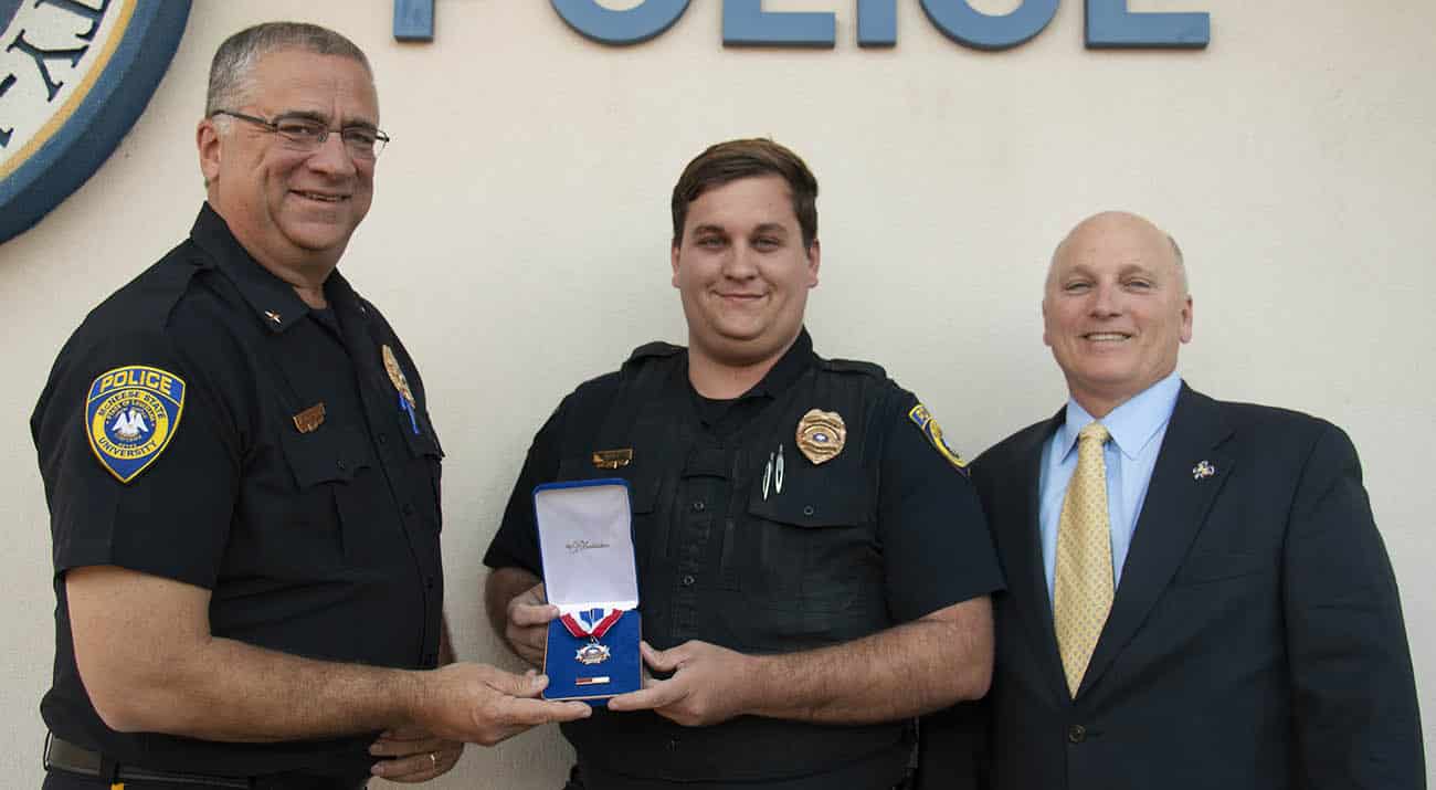 Will Scheufens, McNeese Police Chief, John Gill, McNeese Police Officer, and Dr. Daryl Burckel, McNeese President.