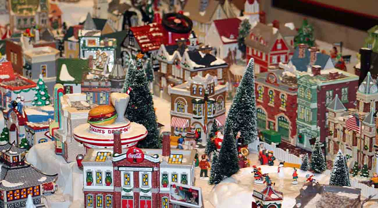 A close up look at some of the buildings in the snow village.