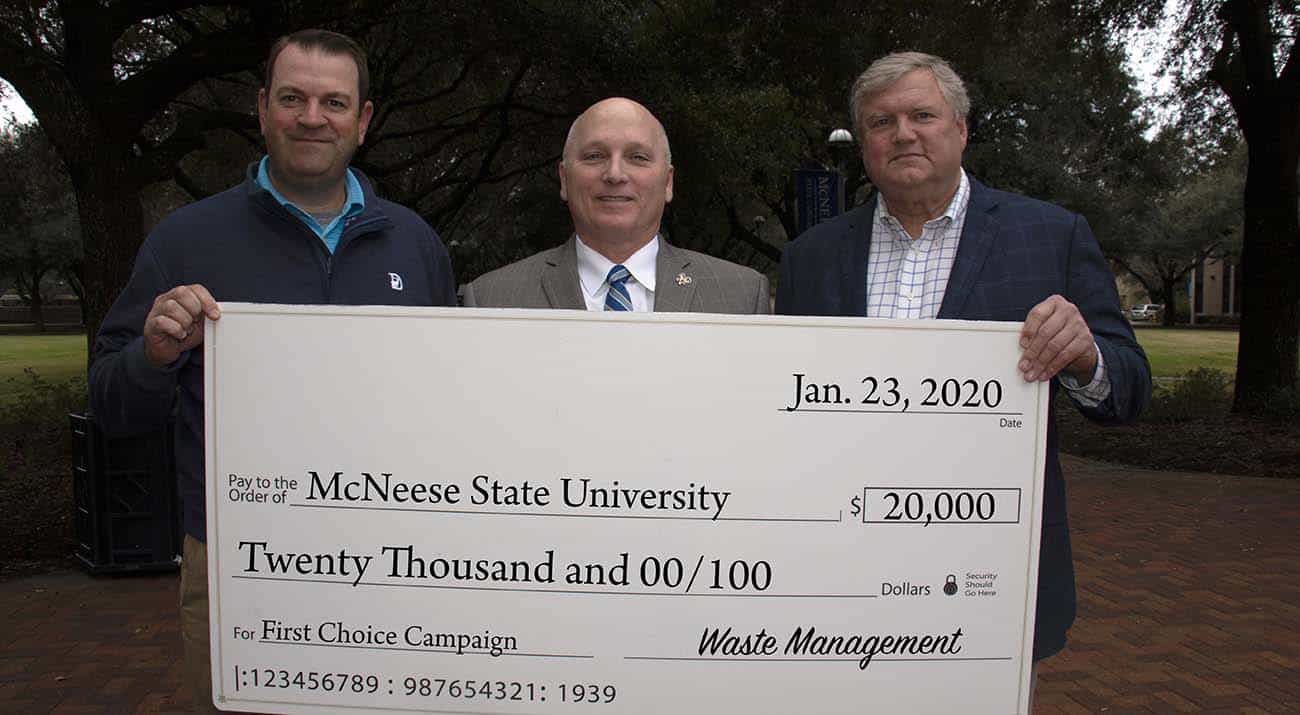 Waste Management officials Rene’ Faucheux, Gulf Coast Area manager for government and community affairs, and Todd Washburn, Gulf Coast Area director for disposal operations, presented the second installment of a three-year pledge to McNeese State University President Dr. Daryl Burckel.