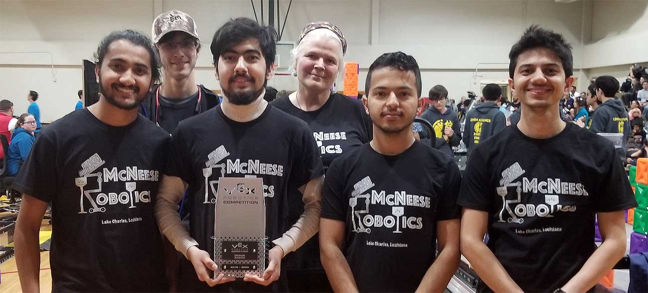 Team members pose with award