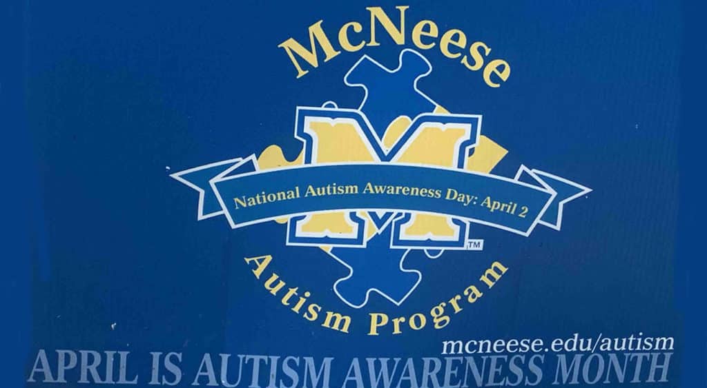 A yard sign with the MAP logo highlights National Autism Month.