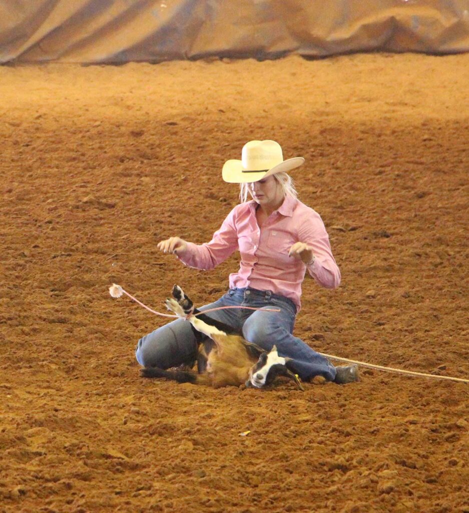 McNeese women's team member ties goat during competition