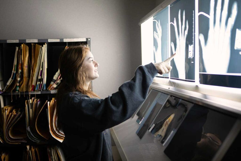 Student examining X Rays