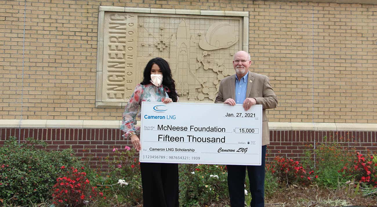 On hand for the presentation are, from left, Kayla Powers, Cameron LNG senior human resources representative, and Dr. Tim Hall, dean of the college of science, engineering and mathematics. McNeese Photo