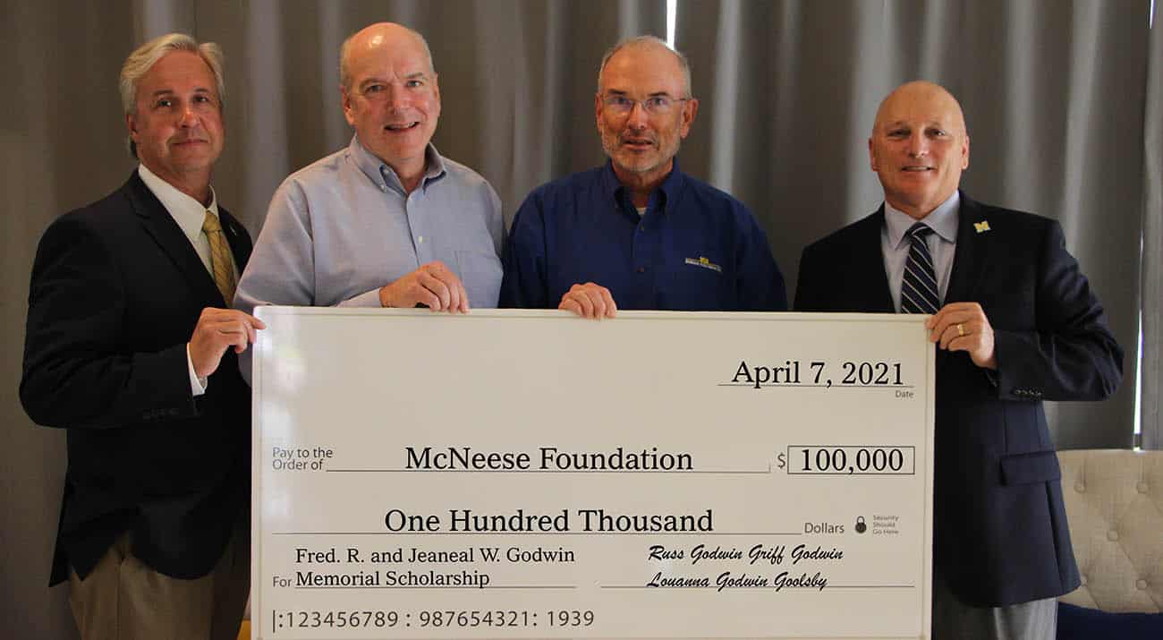 On hand for the presentation are, from left, Dr. Wade Rousse, McNeese vice president for university advancement and dean of the college of business, Griff and Russ Godwin and Dr. Daryl Burckel, McNeese president. McNeese Photo