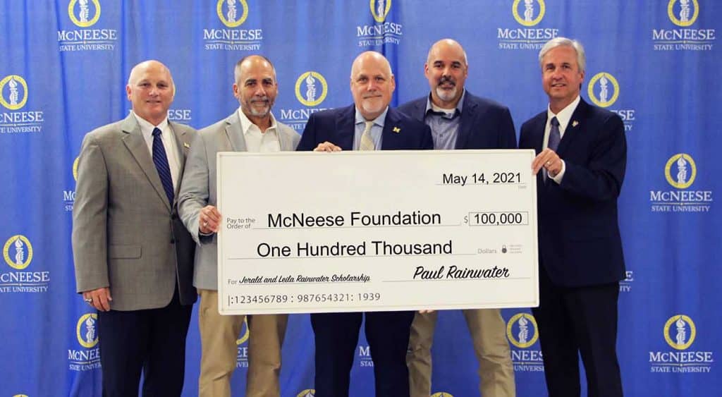 On hand for the presentation are, from left, Dr. Daryl Burckel, McNeese president, Darrell, Paul and Steven Rainwater, and Dr. Wade Rousse, vice president for university advancement and dean of the college of business. McNeese Photo