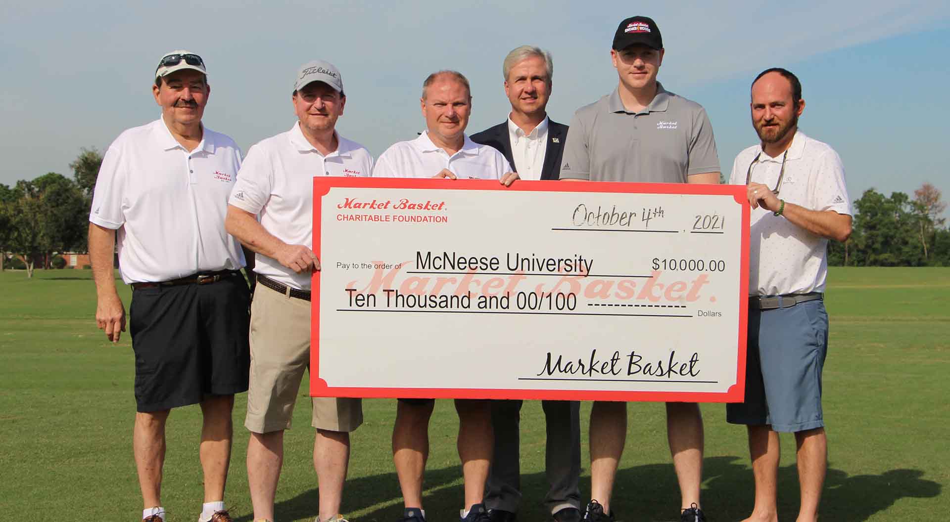 On hand for the presentation are, from left, Steve Cormier, Market Basket senior vice president of retail operations, Skylar Thompson, Market Basket president, Russell Saleme, Market Basket vice president of sales and marketing, Dr. Wade Rousse, McNeese vice president for university advancement, Greg Franz, Market Basket vice president of grocery operations, and David Thompson, Market Basket vice president of perishables. McNeese Photo