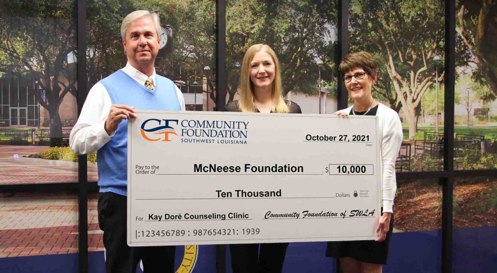 On hand for the donation are, from left, Dr. Wade Rousse, McNeese vice president for university advancement, April Broussard, operations director for the Kay Doré Counseling Clinic and Sara McLeod Judson, president and CEO of the Community Foundation of Southwest Louisiana. McNeese Photo