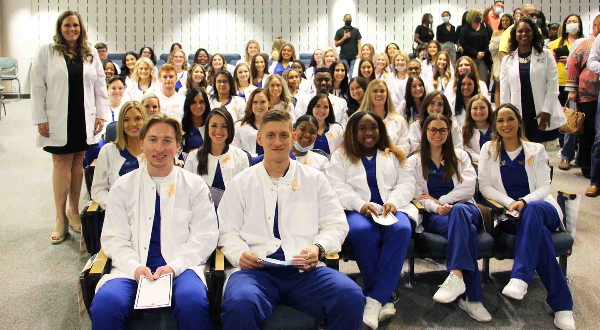 Nursing students with their new white coats.