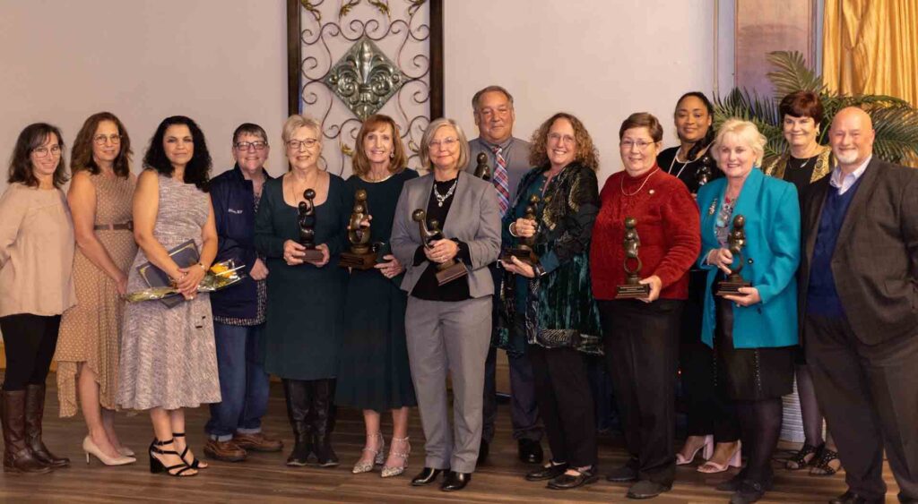 Nursing faculty and guests stand for a photo